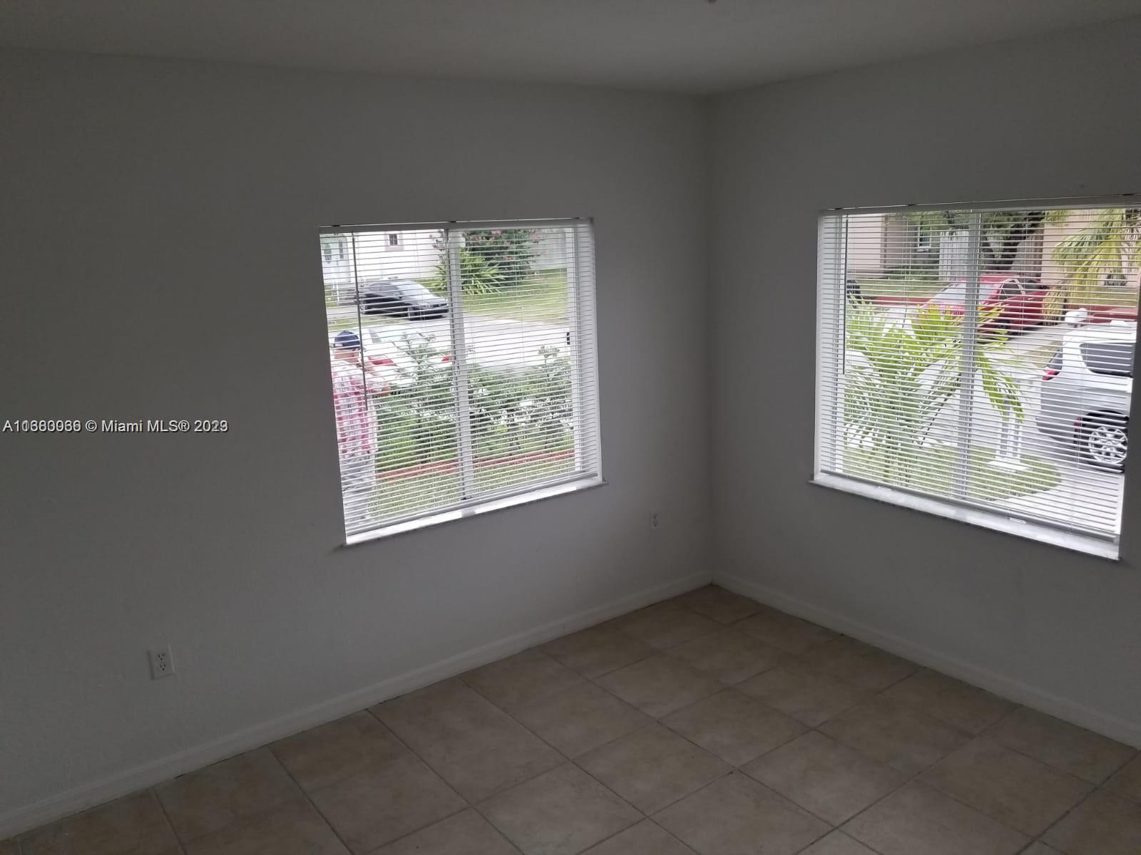 13622 Southwest 285th Terrace Homestead, FL 33033 - Photo 17 of 28 an empty room with a window