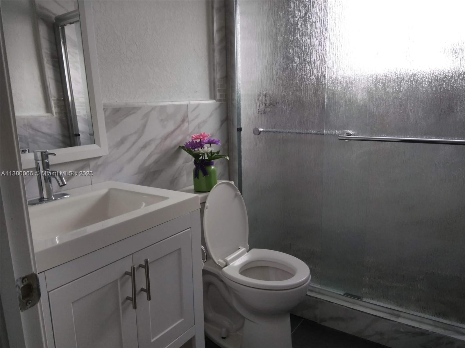 13622 Southwest 285th Terrace Homestead, FL 33033 - Photo 18 of 28 a bathroom with a sink a toilet and shower