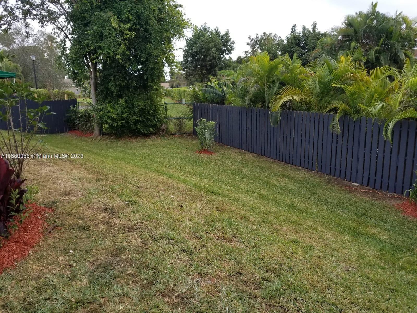 13622 Southwest 285th Terrace Homestead, FL 33033 - Photo 23 of 28 a backyard of a house with lots of green space