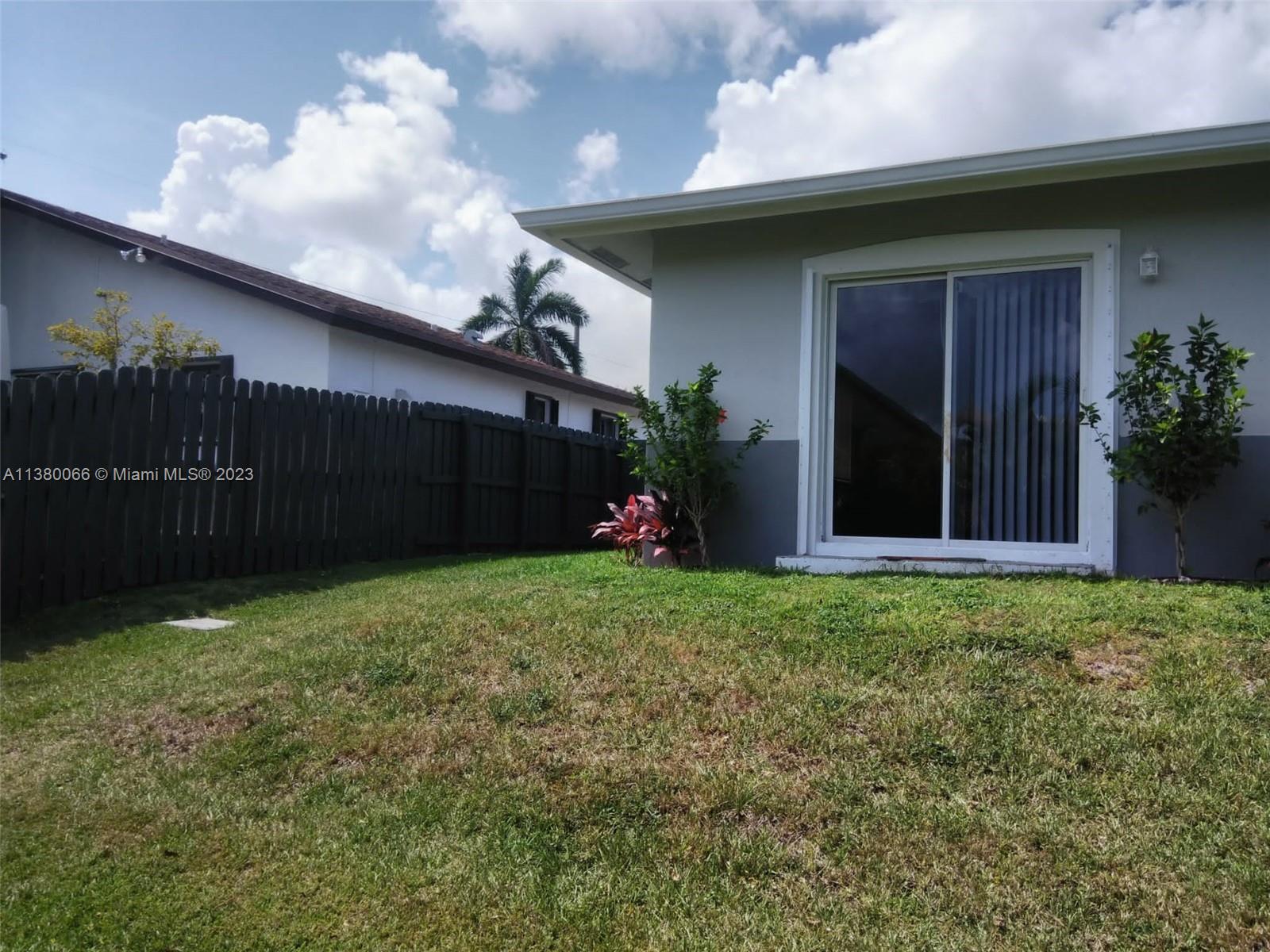 13622 Southwest 285th Terrace Homestead, FL 33033 - Photo 25 of 28 a house view with a garden space