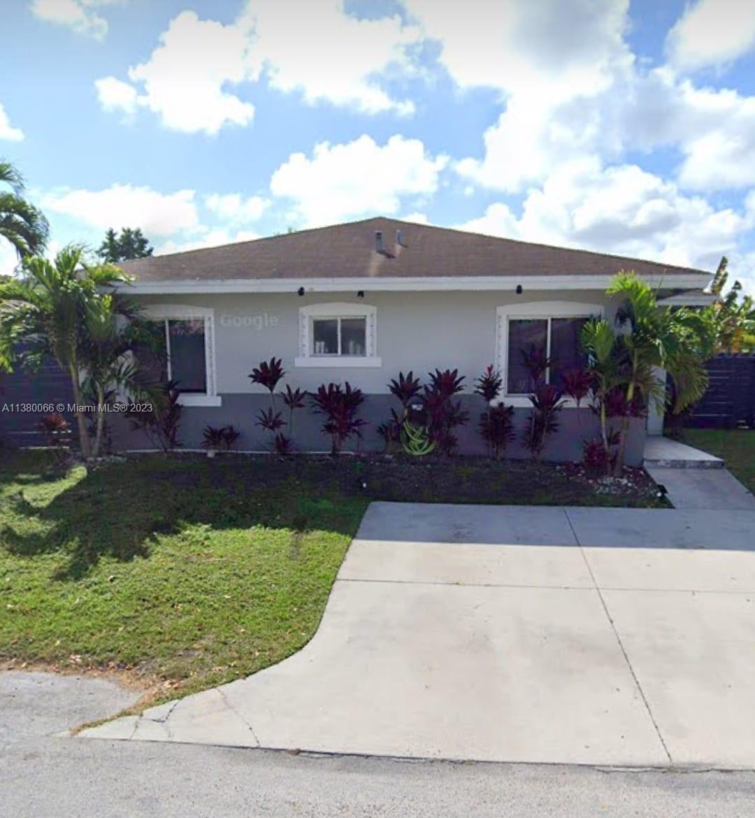 13622 Southwest 285th Terrace Homestead, FL 33033 - Photo 3 of 28 a front view of house with yard and outdoor seating