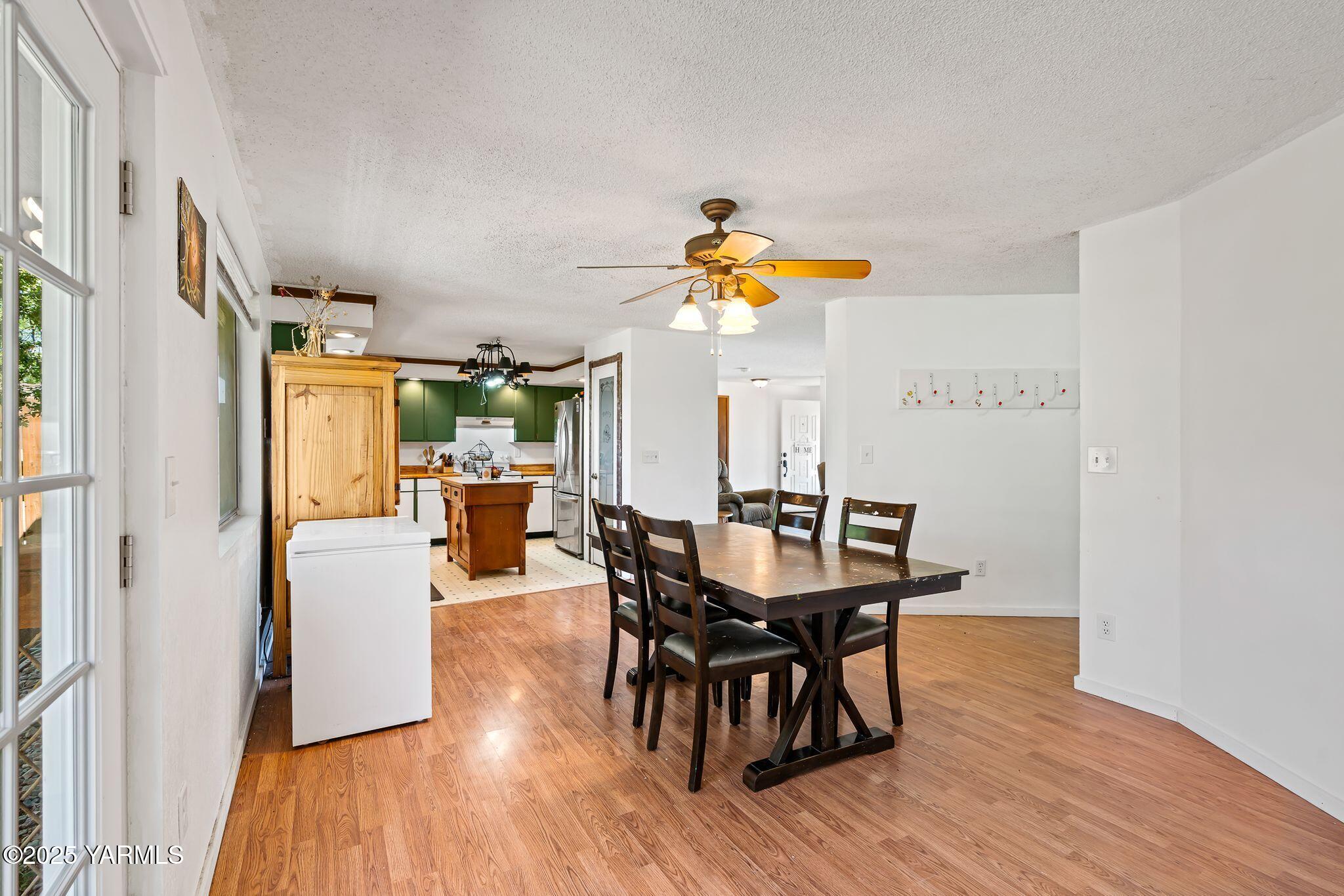 1620 Selah Loop Road Selah, WA 98942 - Photo 22 of 33 a dining room with furniture and wooden floor