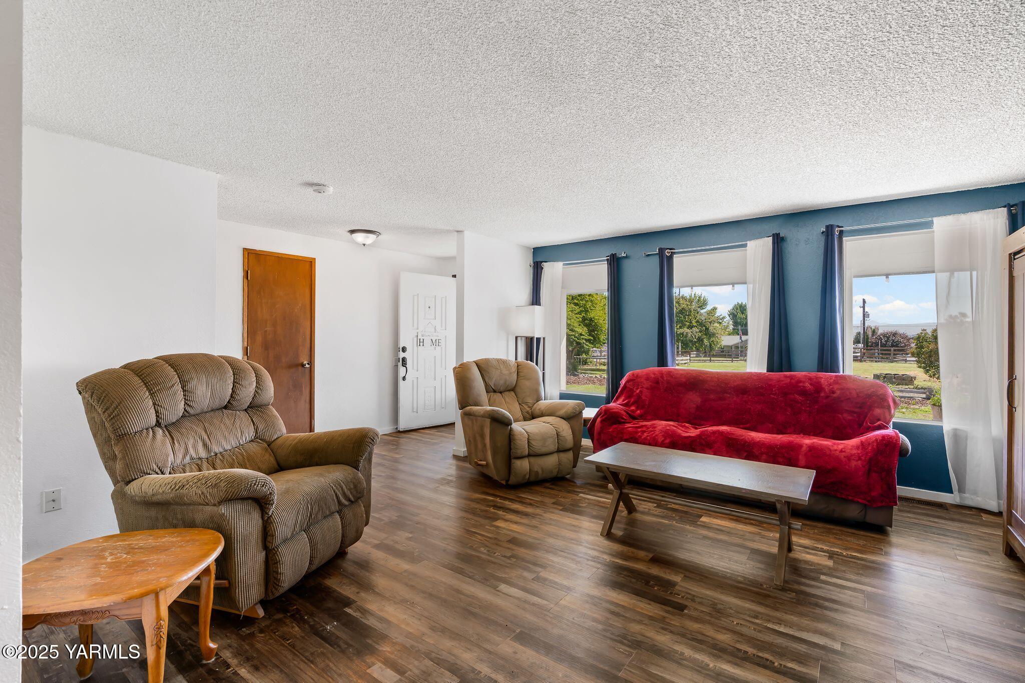 1620 Selah Loop Road Selah, WA 98942 - Photo 5 of 33 a living room with furniture and a large window
