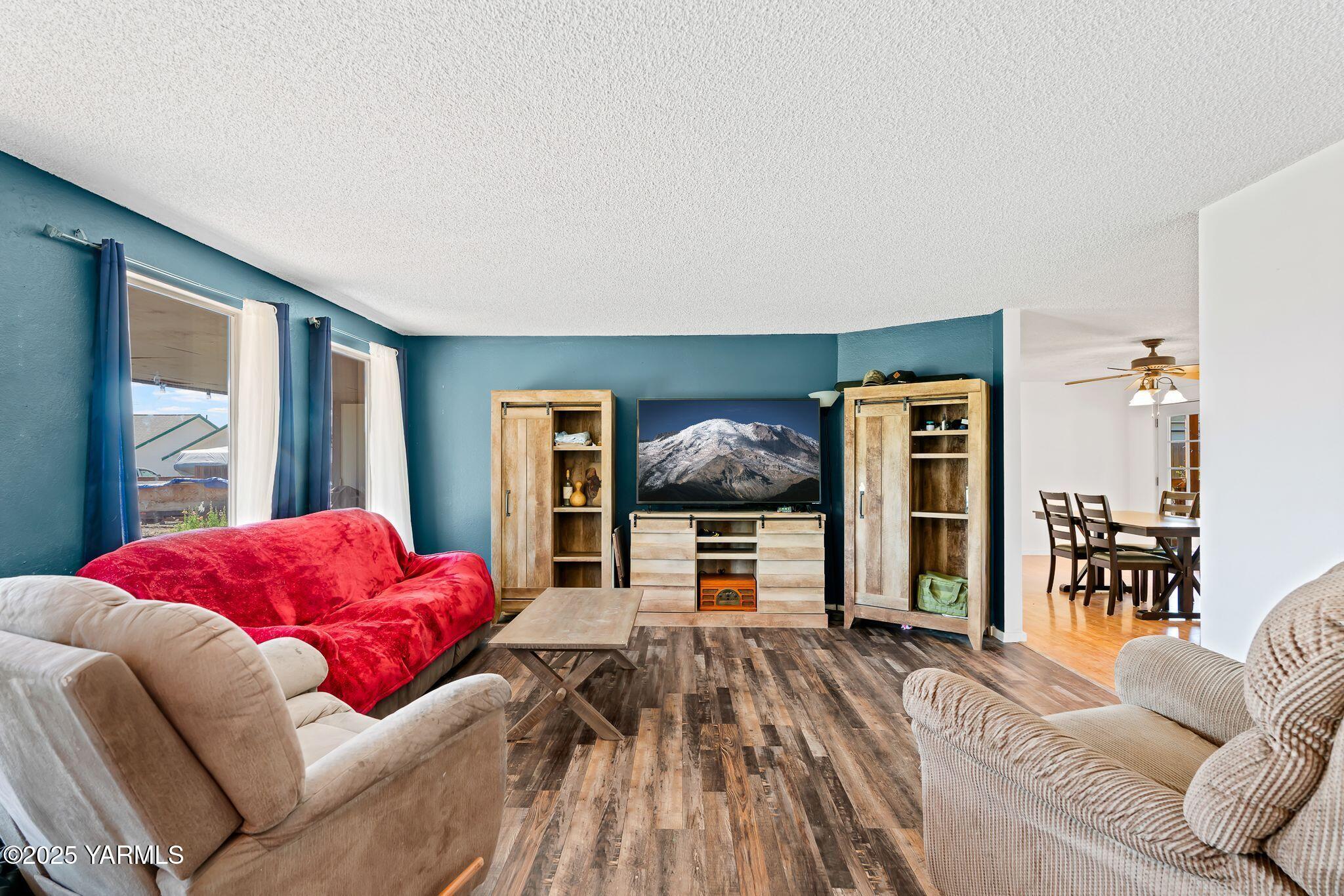 1620 Selah Loop Road Selah, WA 98942 - Photo 6 of 33 a living room with furniture and a flat screen tv