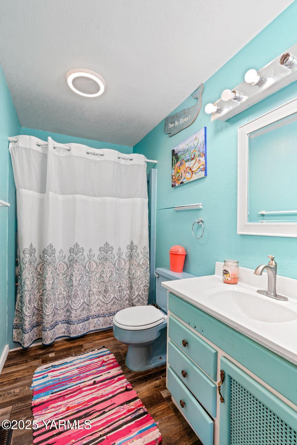 1620 Selah Loop Road Selah, WA 98942 - Photo 8 of 33 a bathroom with a sink mirror vanity and toilet