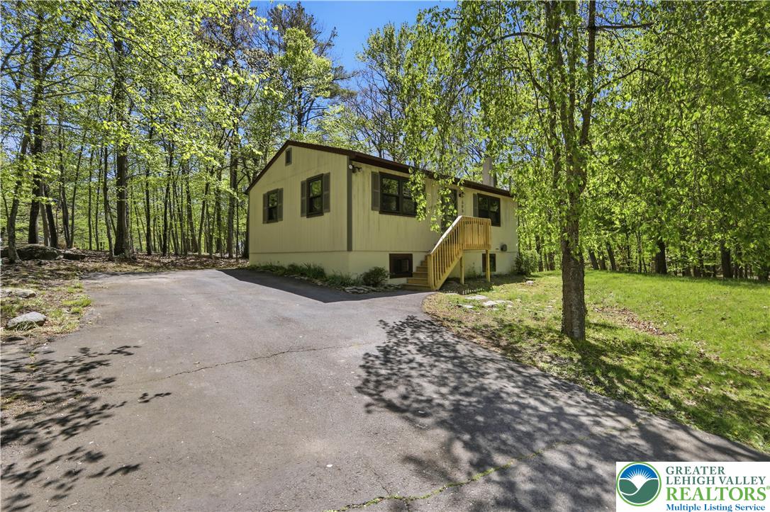 505 Chipmunk Road Bushkill, PA 18324 - Photo 35 of 46 a house view with a backyard space