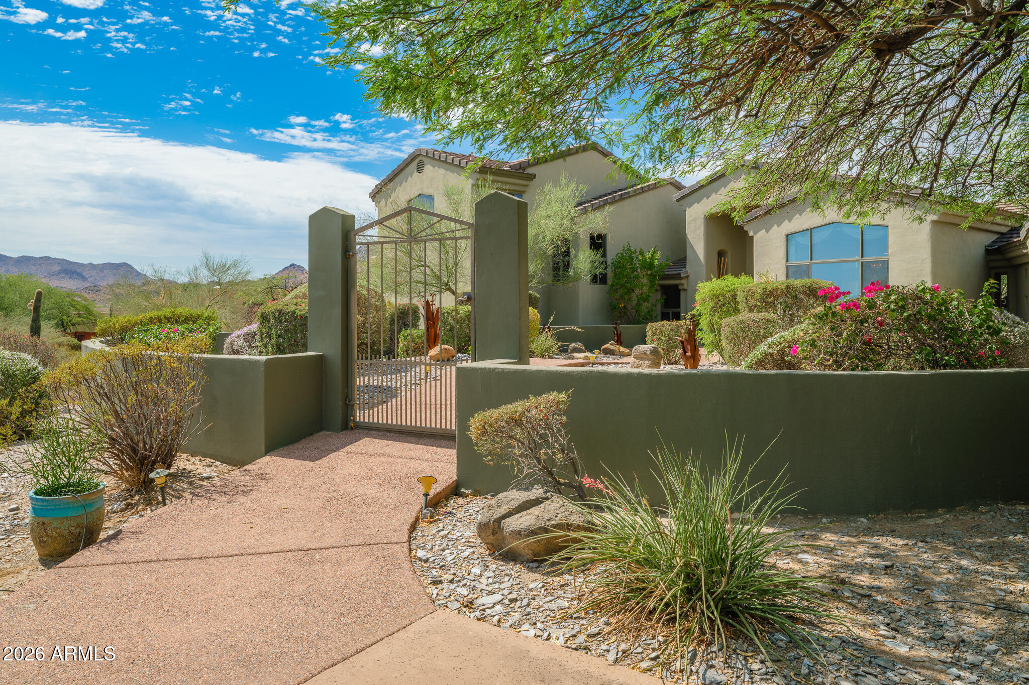 2329 East Hatcher Road Phoenix, AZ 85028 - Photo 6 of 40 a front view of a house with a garden