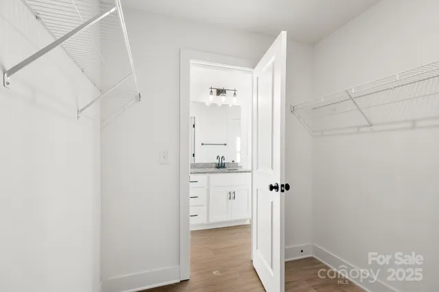 a bathroom with a granite countertop sink