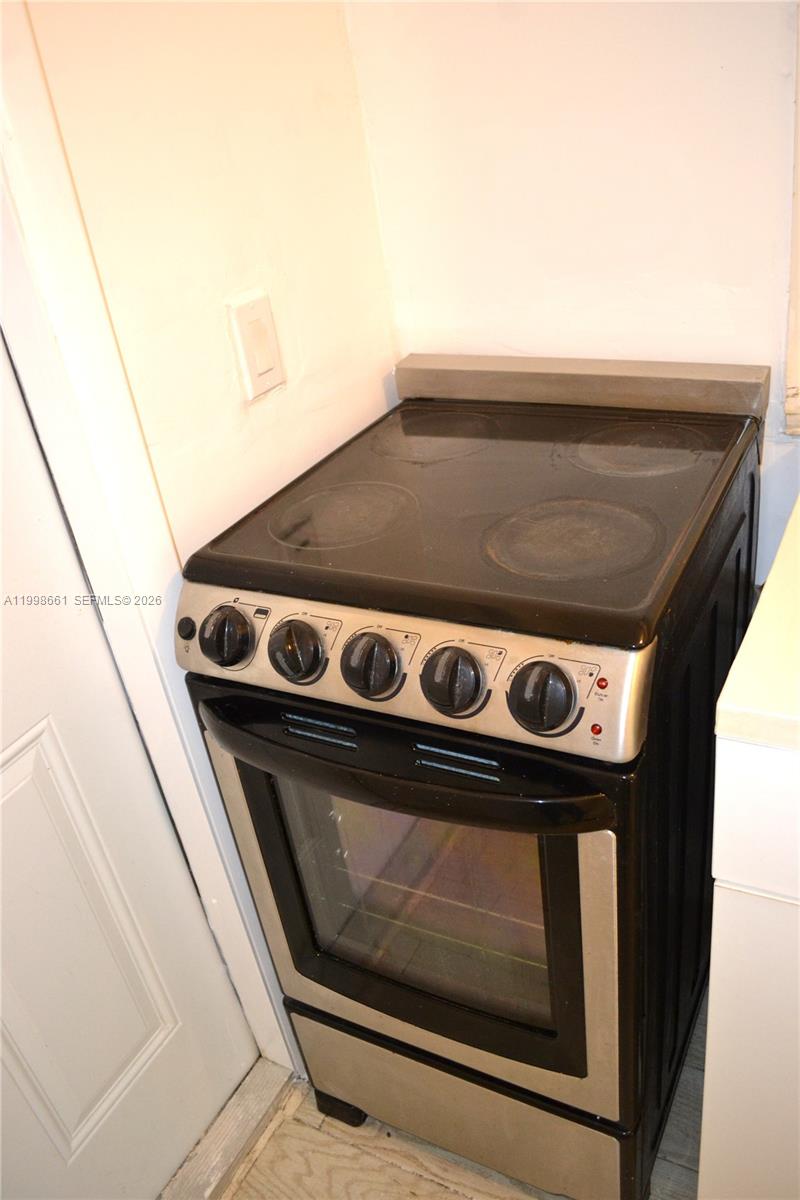 1037 Southwest 4th Street, Unit 4 Miami, FL 33130 - Photo 11 of 12 a stove top oven sitting inside of a kitchen