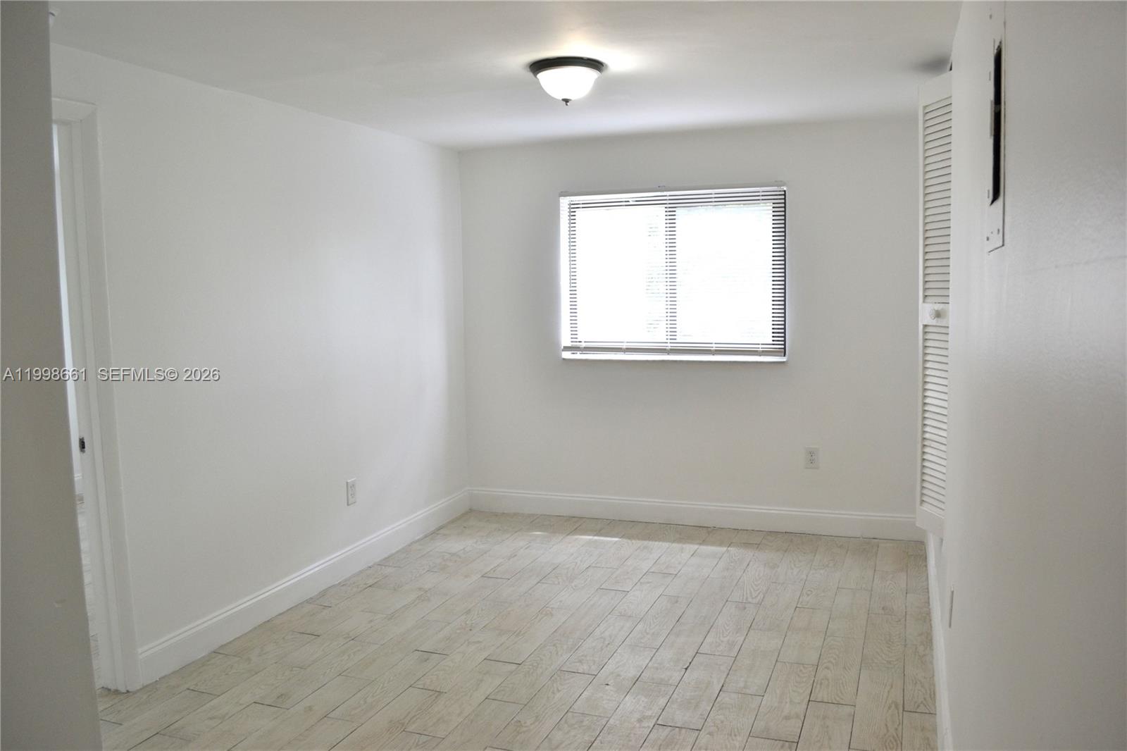 1037 Southwest 4th Street, Unit 4 Miami, FL 33130 - Photo 3 of 12 an empty room with a window