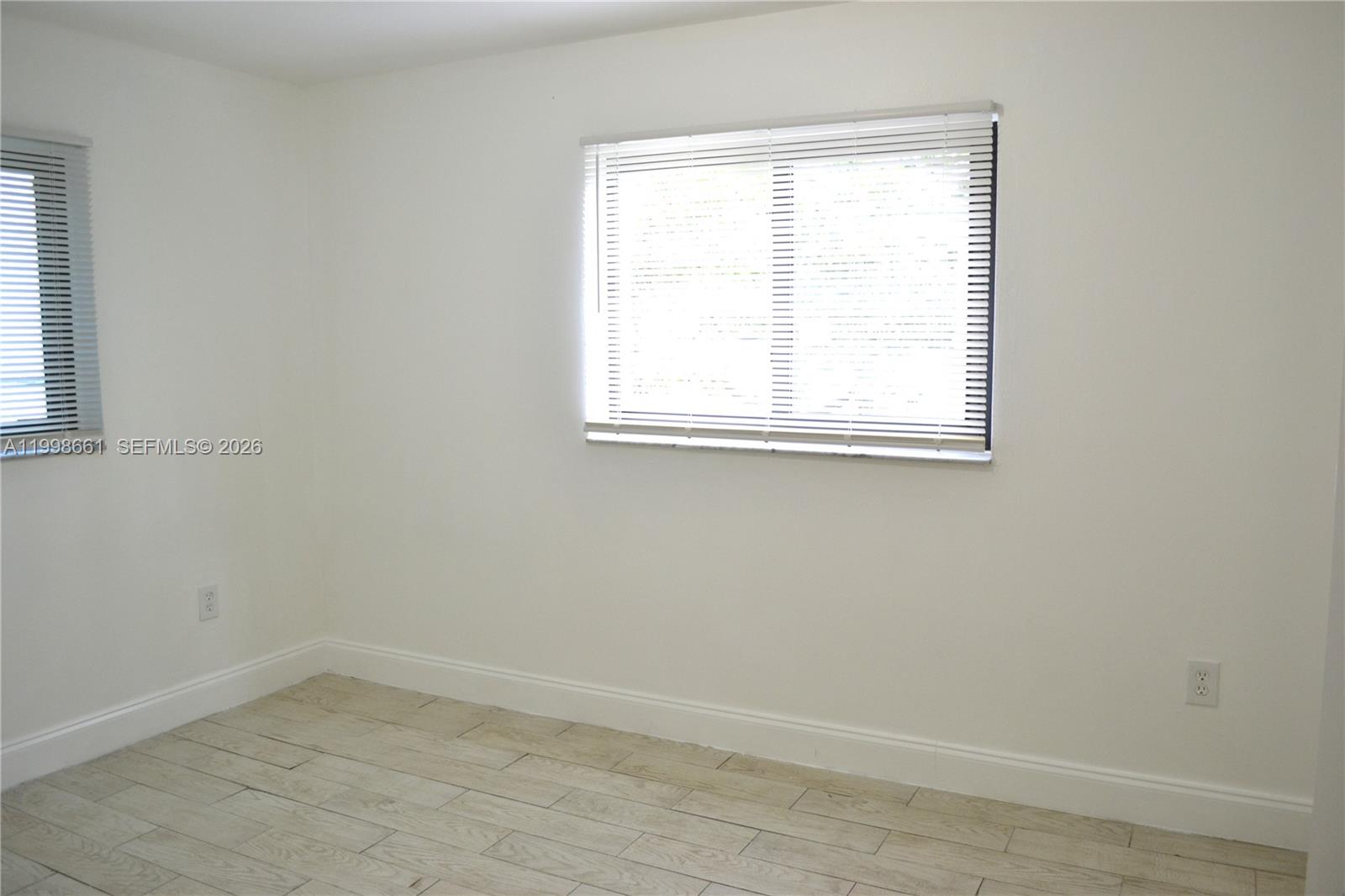1037 Southwest 4th Street, Unit 4 Miami, FL 33130 - Photo 4 of 12 an empty room with a window