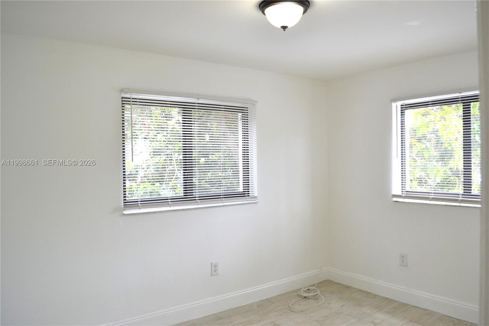 1037 Southwest 4th Street, Unit 4 Miami, FL 33130 - Photo 5 of 12 an empty room with a window