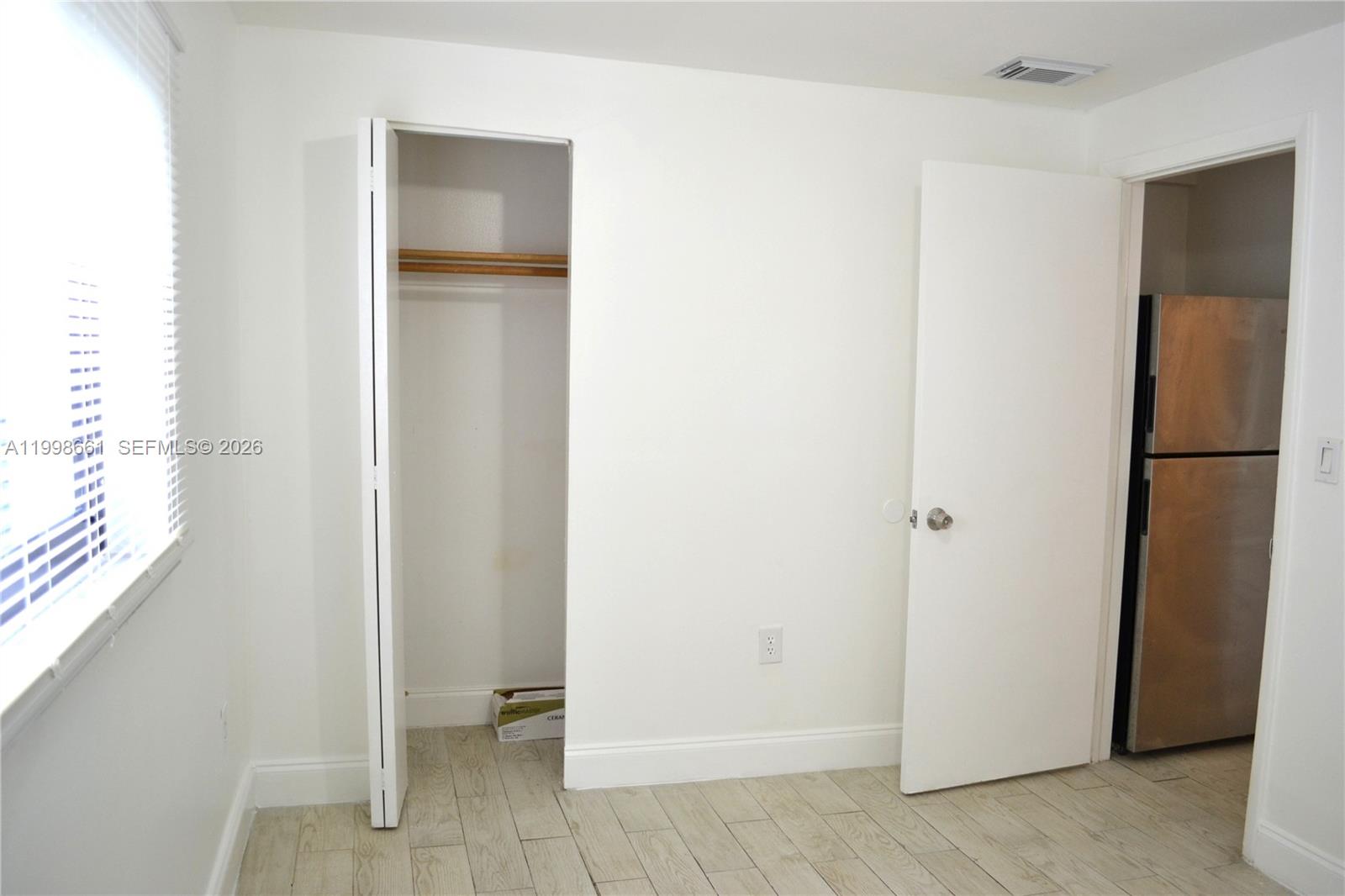 1037 Southwest 4th Street, Unit 4 Miami, FL 33130 - Photo 6 of 12 a view of bathroom with a sink and a mirror