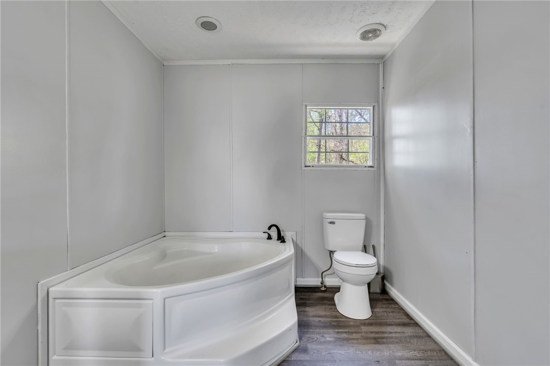 119 Ray Drive Pickens, SC 29671 - Photo 16 of 27 This bathroom features a deep corner tub, offering a relaxing escape.