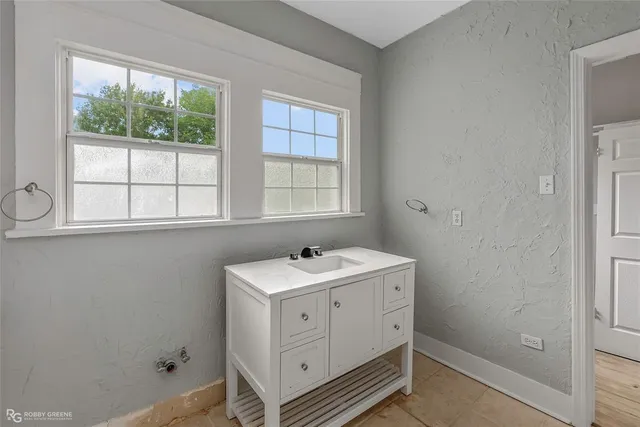 a view of bathroom with dual sinks