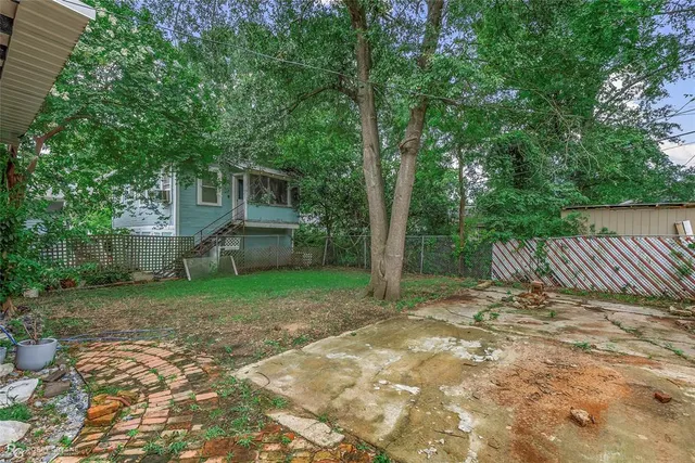 a view of a backyard with a small cabin