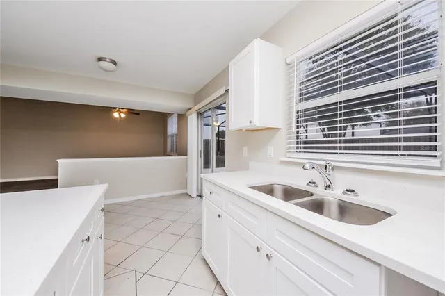 a kitchen with a sink and cabinets