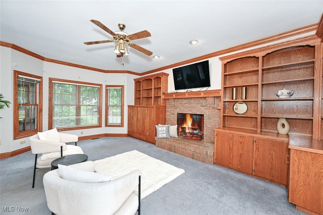 452 Herbert Road Akron, OH 44312 - Photo 7 of 48 *COZY FAMILY ROOM W/FIREPLACE, BUILT IN SHELVING AND CABINETS, CEILING FAN NEAR LIVING RM AND EAT IN KITCHEN W/9 FT CEILING, CROWN MOLDING ~