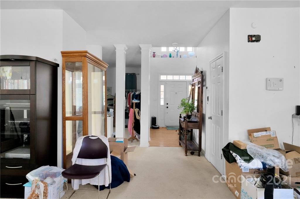 3800 Ruth Street Indian Trail, NC 28079 - Photo 11 of 34 a living room with furniture and a potted plant