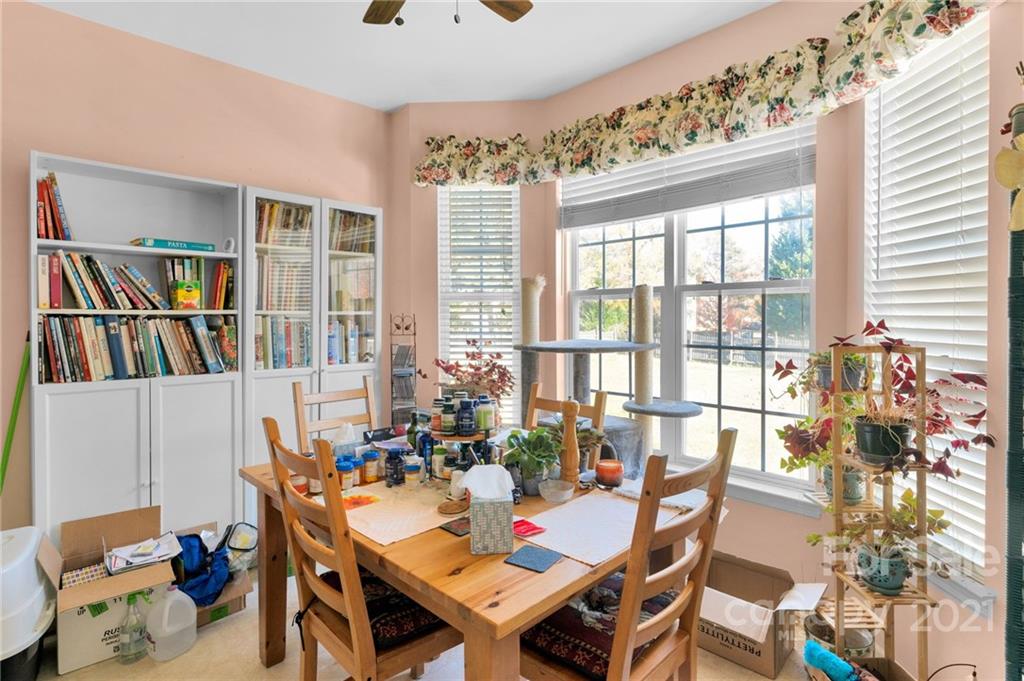 3800 Ruth Street Indian Trail, NC 28079 - Photo 14 of 34 a view of a dining room with furniture window and wooden floor