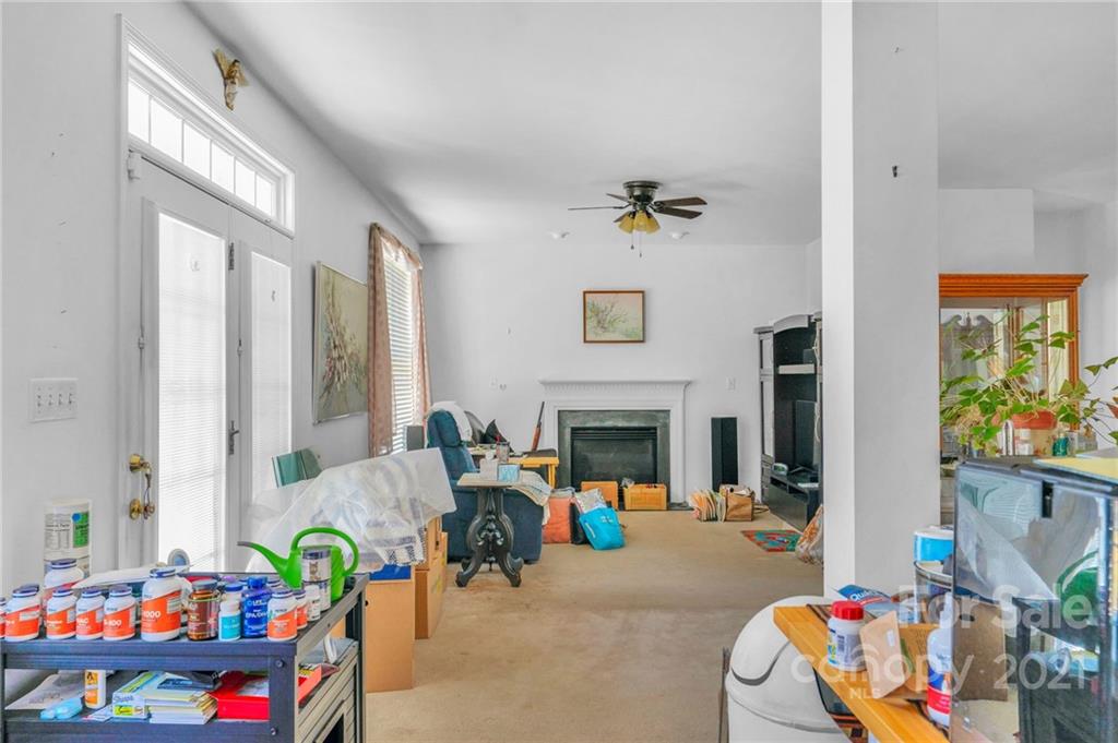 3800 Ruth Street Indian Trail, NC 28079 - Photo 15 of 34 a living room with furniture fireplace and a potted plant