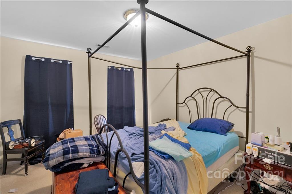 3800 Ruth Street Indian Trail, NC 28079 - Photo 17 of 34 a bedroom with a bed and a dresser