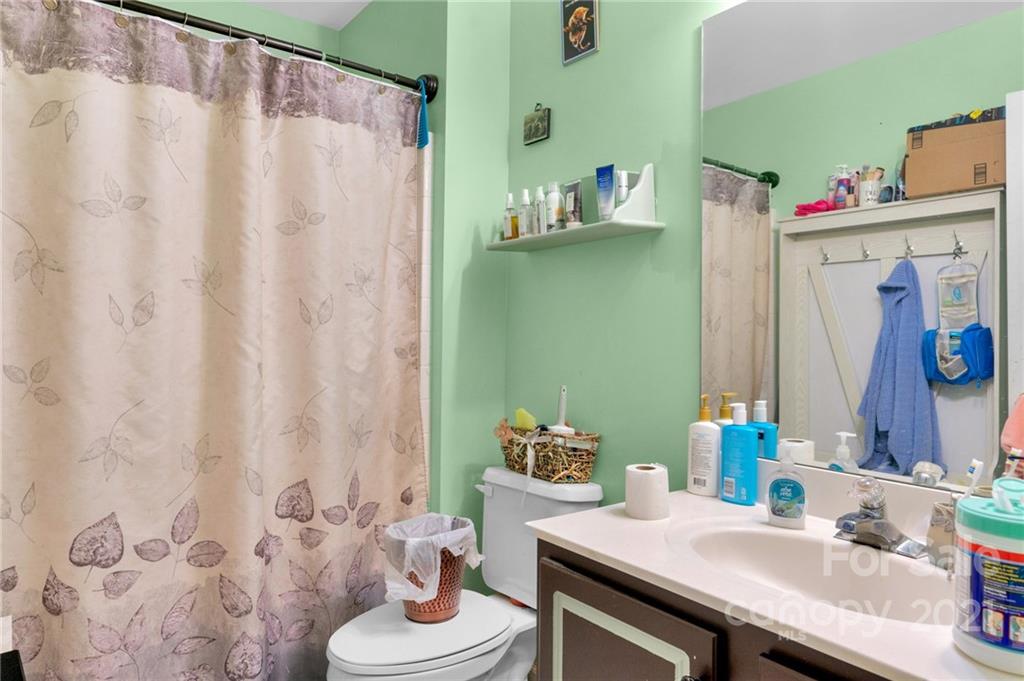 3800 Ruth Street Indian Trail, NC 28079 - Photo 19 of 34 a bathroom with a sink and a mirror