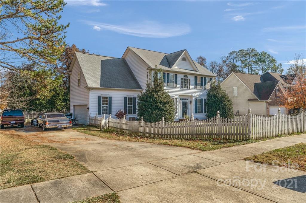3800 Ruth Street Indian Trail, NC 28079 - Photo 3 of 34 a front view of a house with a garden and fence