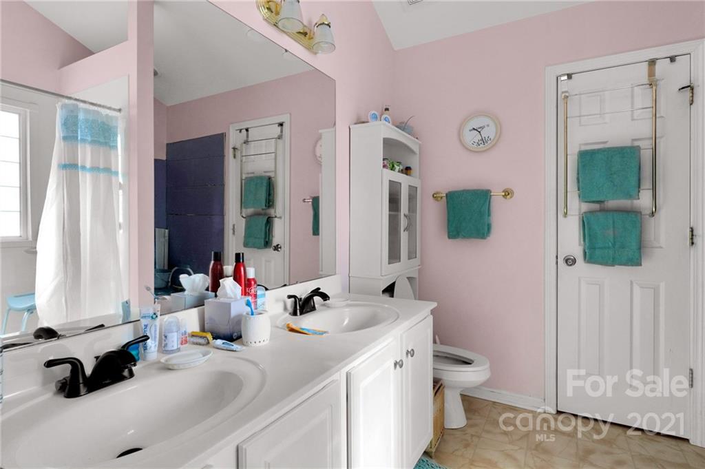 3800 Ruth Street Indian Trail, NC 28079 - Photo 24 of 34 a bathroom with a double vanity sink toilet and a tub