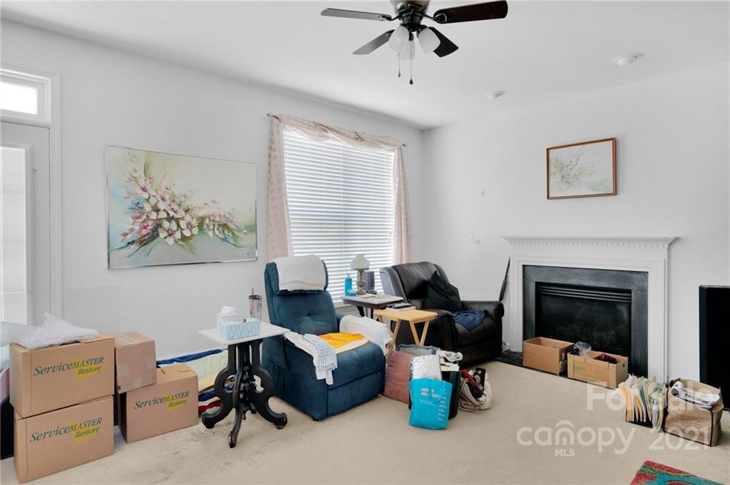 3800 Ruth Street Indian Trail, NC 28079 - Photo 8 of 34 a living room with furniture and a fireplace