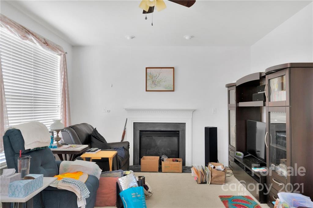3800 Ruth Street Indian Trail, NC 28079 - Photo 9 of 34 a living room with furniture fireplace and flat screen tv