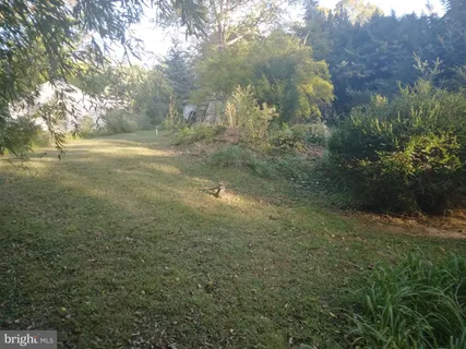 a picture of a room with furniture and white walls