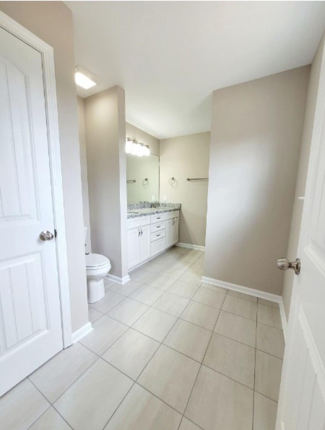 1588 Gilliam Hollow Road Dickson, TN 37055 - Photo 7 of 8 a bathroom with a granite countertop sink a toilet and a mirror