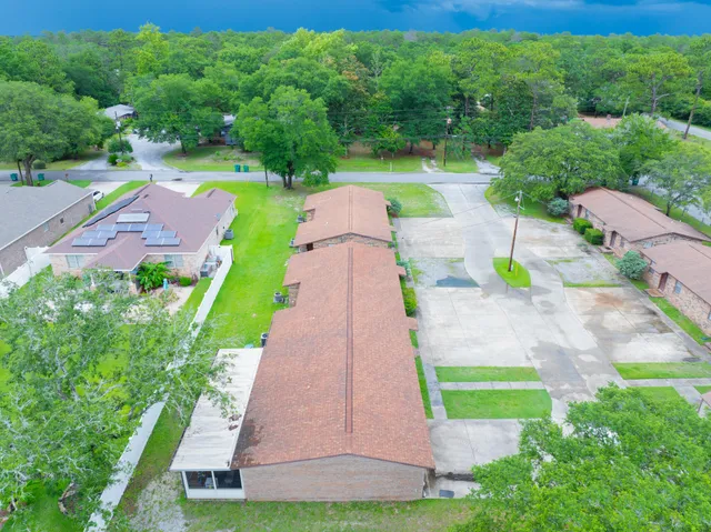 a view of a yard with flower plants
