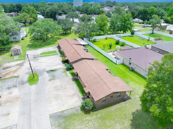an aerial view of a house with a swimming pool