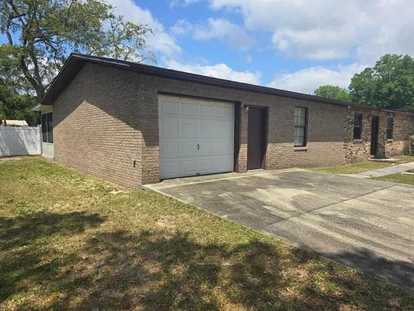 a house with yard in front of it