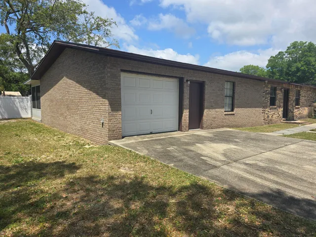 a house with yard in front of it