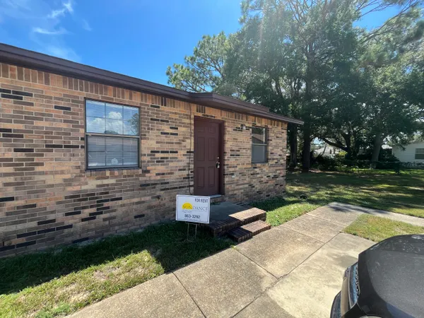 a backyard of a house with lots of green space