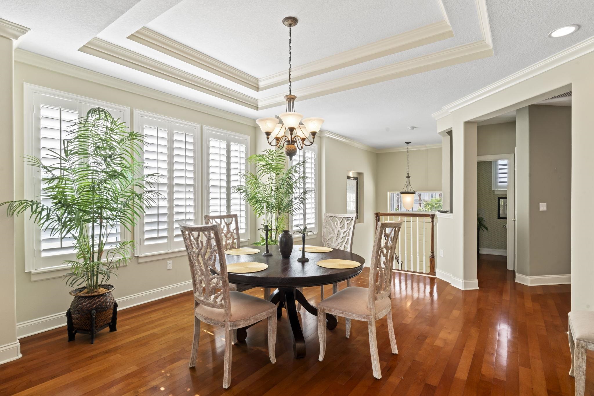 103 Sunset Circle South St. Augustine, FL 32080 - Photo 19 of 55 a view of a dining room with furniture window and wooden floor