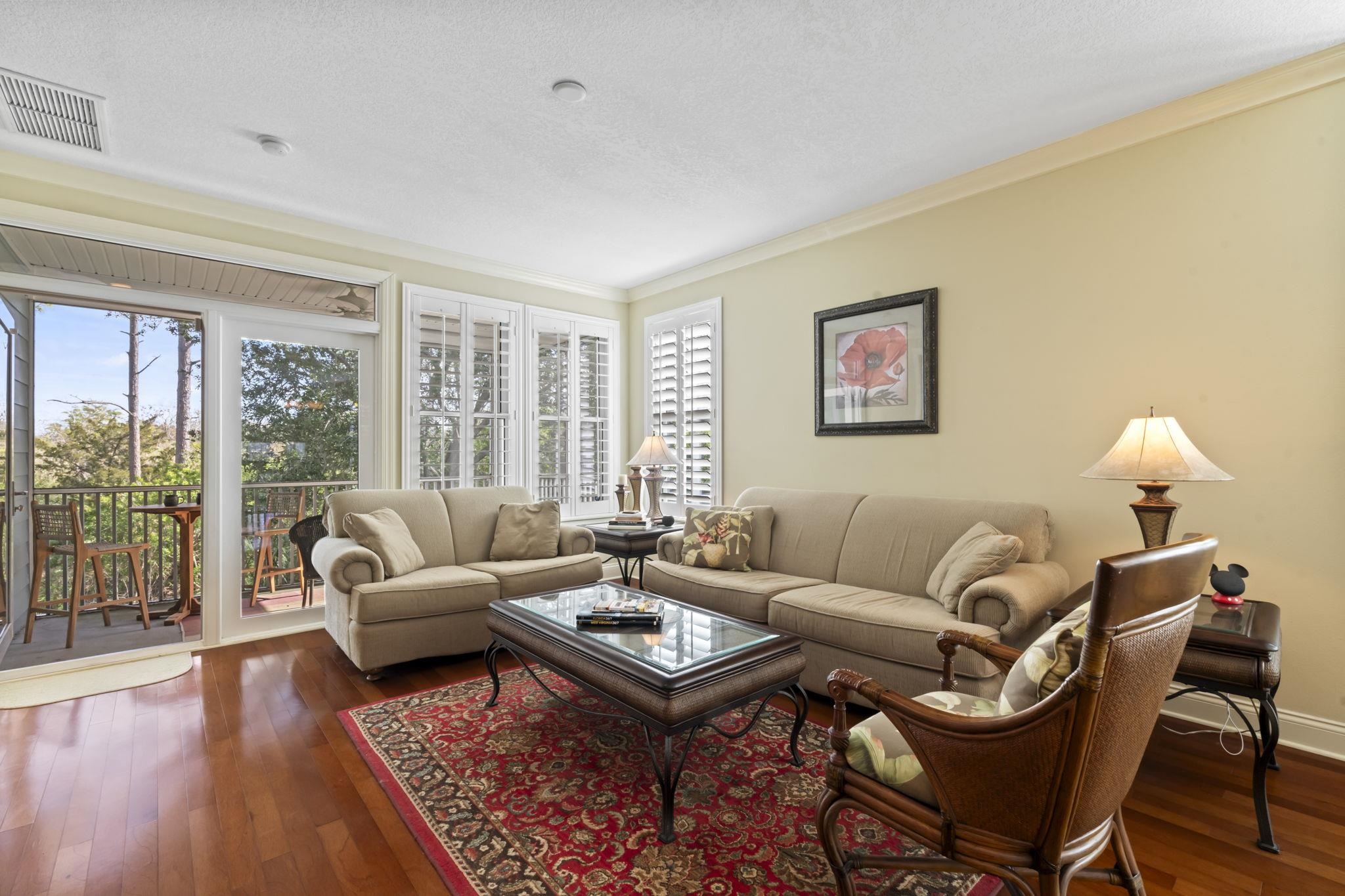 103 Sunset Circle South St. Augustine, FL 32080 - Photo 21 of 55 a living room with furniture a rug and a large window
