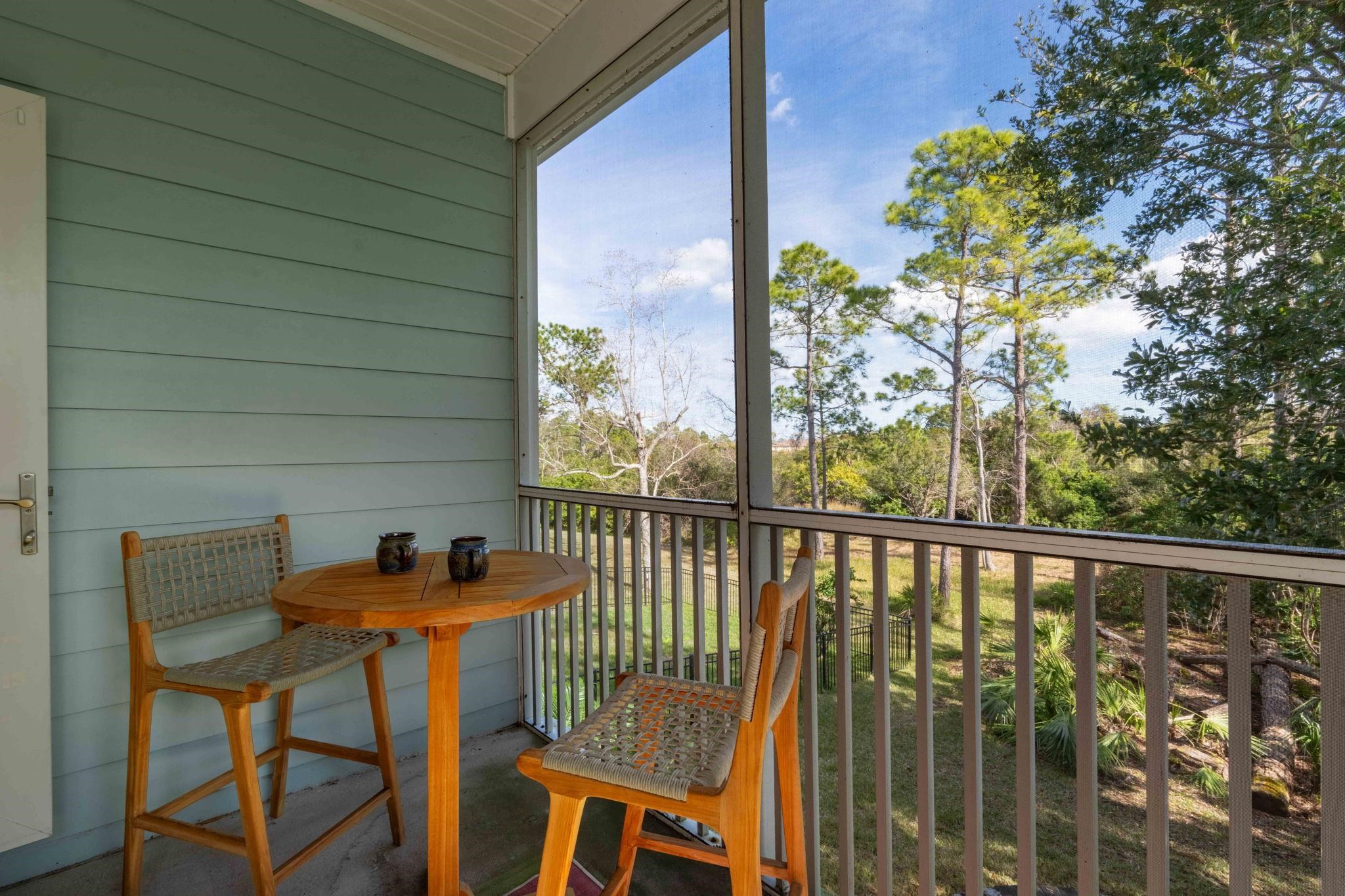 103 Sunset Circle South St. Augustine, FL 32080 - Photo 25 of 55 a view of a chairs and table in the balcony