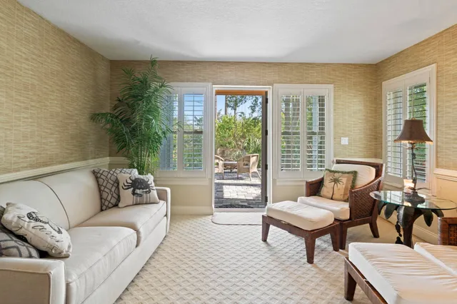 a view of a chairs and table in the patio