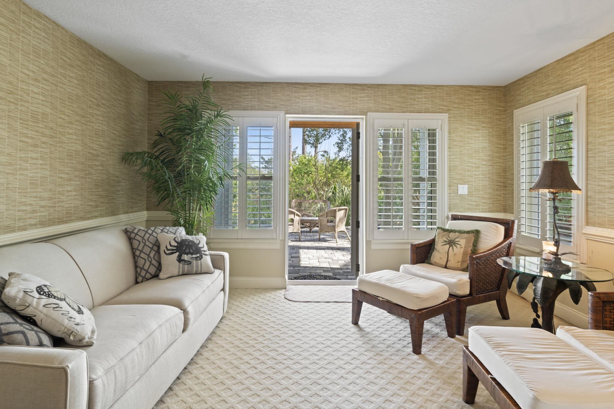 103 Sunset Circle South St. Augustine, FL 32080 - Photo 36 of 55 a living room with furniture and a large window