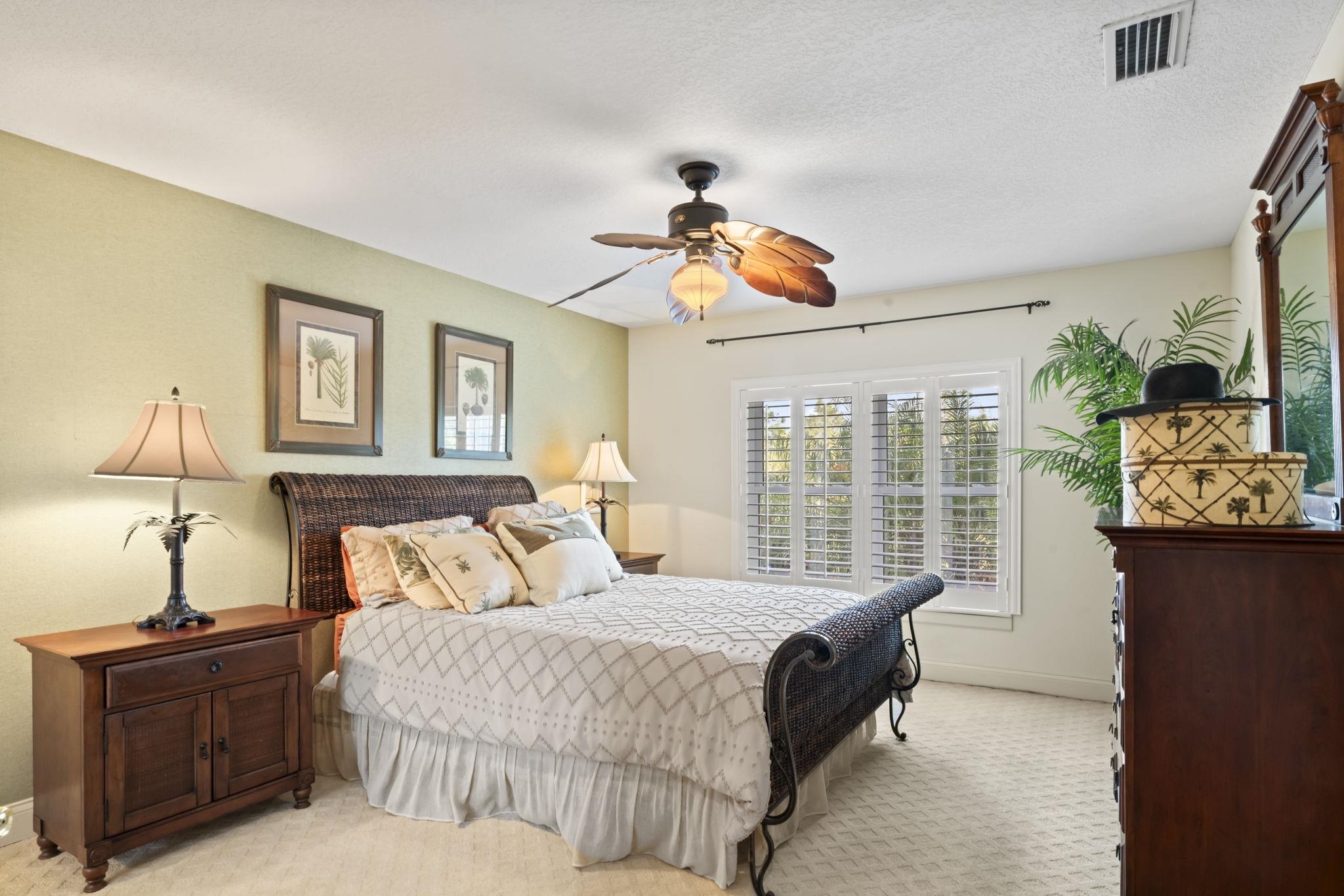 103 Sunset Circle South St. Augustine, FL 32080 - Photo 41 of 55 a bed room with a bed and a chandelier