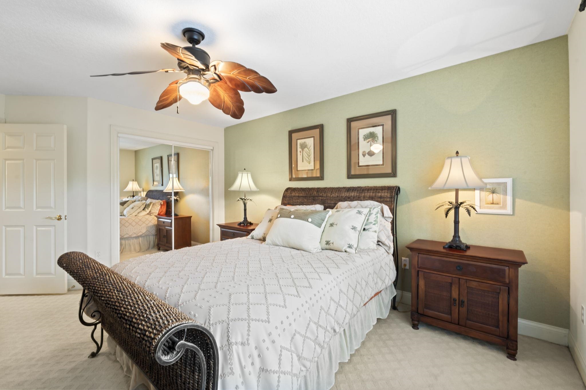 103 Sunset Circle South St. Augustine, FL 32080 - Photo 42 of 55 a bedroom with a bed and a chandelier