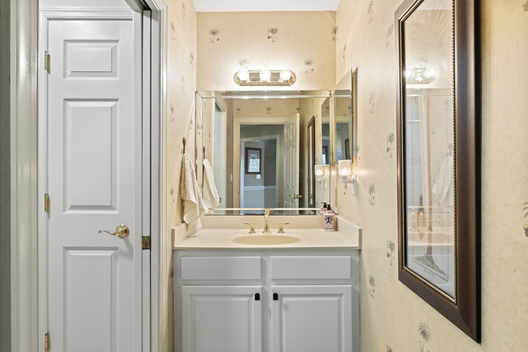 103 Sunset Circle South St. Augustine, FL 32080 - Photo 43 of 55 a bathroom with a sink and a mirror