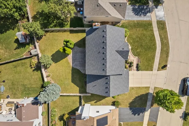 an aerial view of a house with a swimming pool