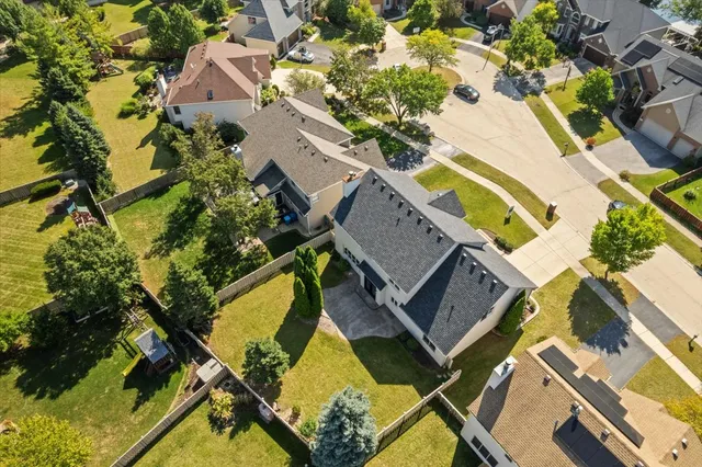 an aerial view of a house with a swimming pool