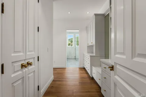 a view of walk in closet with empty racks