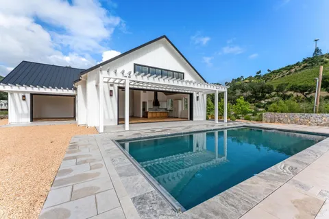a view of a swimming pool with an outdoor space